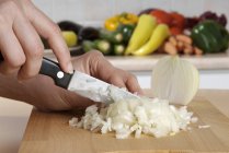 Chopping onions finely — Stock Photo