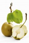 Whole and halved Nashi pears — Stock Photo