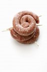 Coiled sausages with cocktail sticks — Stock Photo