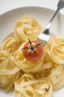 Tagliatelle pasta with cherry tomato — Stock Photo