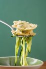 Cooked ravioli pasta with courgette laces — Stock Photo