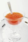 Trout caviar with mother-of-pearl spoon — Stock Photo