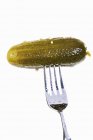 Pickled gherkin on fork — Stock Photo