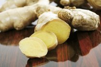 Fresh partly sliced ginger root — Stock Photo