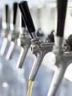 Closeup view of pouring Spezi from tap row — Stock Photo