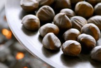 Chestnuts in a dish, close-up — Stock Photo