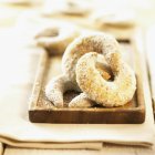 Closeup view of vanilla crescents on wooden tray — Stock Photo