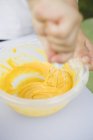 Hands mixing flour — Stock Photo