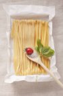 Tagliatelle pasta and tomato — Stock Photo