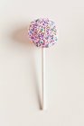 Cake pop decorated with sugar sprinkles — Stock Photo
