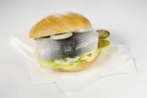 Herring roll with gherkin and onion — Stock Photo