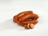 Paprika sausages with slices — Stock Photo