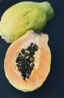 Fresh halved papaya — Stock Photo