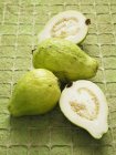 Fresh whole and halved Guavas — Stock Photo