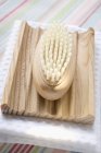 Closeup view of wooden soap dish with brush — Stock Photo