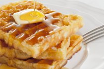 Waffles with butter and honey — Stock Photo