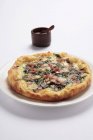 Ham and spinach pizza — Stock Photo
