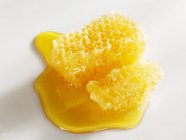 Honeycomb with honey on white — Stock Photo
