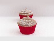 Cappuccino cupcakes dusted with icing sugar — Stock Photo