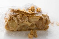 Piece of apple strudel with icing sugar — Stock Photo