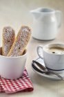 Closeup view of sponge fingers and coffee cup — Stock Photo