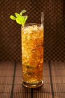Closeup view of mint Julep cocktail with straw and ice — Stock Photo