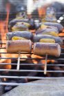Sausages and pepper kebabs on barbecue — Stock Photo