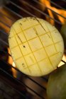 Mango on barbecue grill rack — Stock Photo