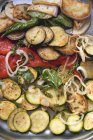 Roasted vegetables with herbs on tray — Stock Photo