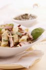 Penne pasta with bacon and pesto — Stock Photo