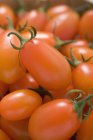 Cherry tomatoes in basket — Stock Photo