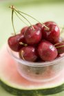 Cherries in plastic tub — Stock Photo