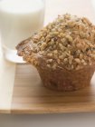Muffin topped with chopped nuts — Stock Photo
