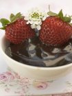 Strawberries in chocolate sauce — Stock Photo