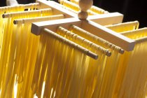 Homemade tagliatelle pasta drying — Stock Photo