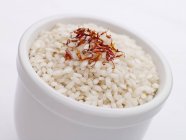 Arborio rice with saffron threads — Stock Photo