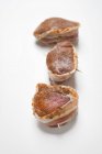 Raw Pork fillets wrapped with bacon — Stock Photo