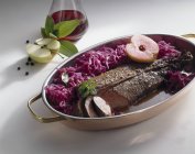 Closeup view of venison meat with red cabbage and apples — Stock Photo