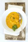 Pumpkin soup with basil — Stock Photo