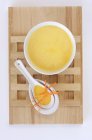 Carrot soup with carrot strips in bowl — Stock Photo