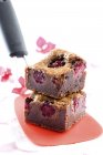 Brownies with raspberries stacked on spatula — Stock Photo