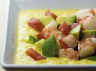 Bowl of Corn Shrimp and Avocado Soup in white dish — Stock Photo
