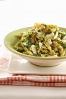 Penne pasta with nuts and herbs — Stock Photo