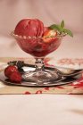 Glass bowl of strawberry sorbet — Stock Photo