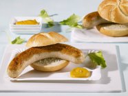 Bread rolls filled with sausages — Stock Photo