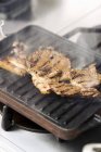 Grill plate with steam — Stock Photo