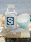 Sea salt in bottle — Stock Photo