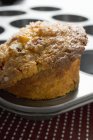 Muffin in muffin tin — Stock Photo