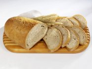 Partly sliced loaf of bread — Stock Photo