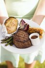 Grilled steak and accompaniments — Stock Photo
